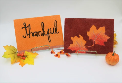 Create fall art with colored sand and adhesive boards!